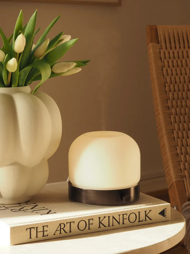 Aroma diffuser stands on book