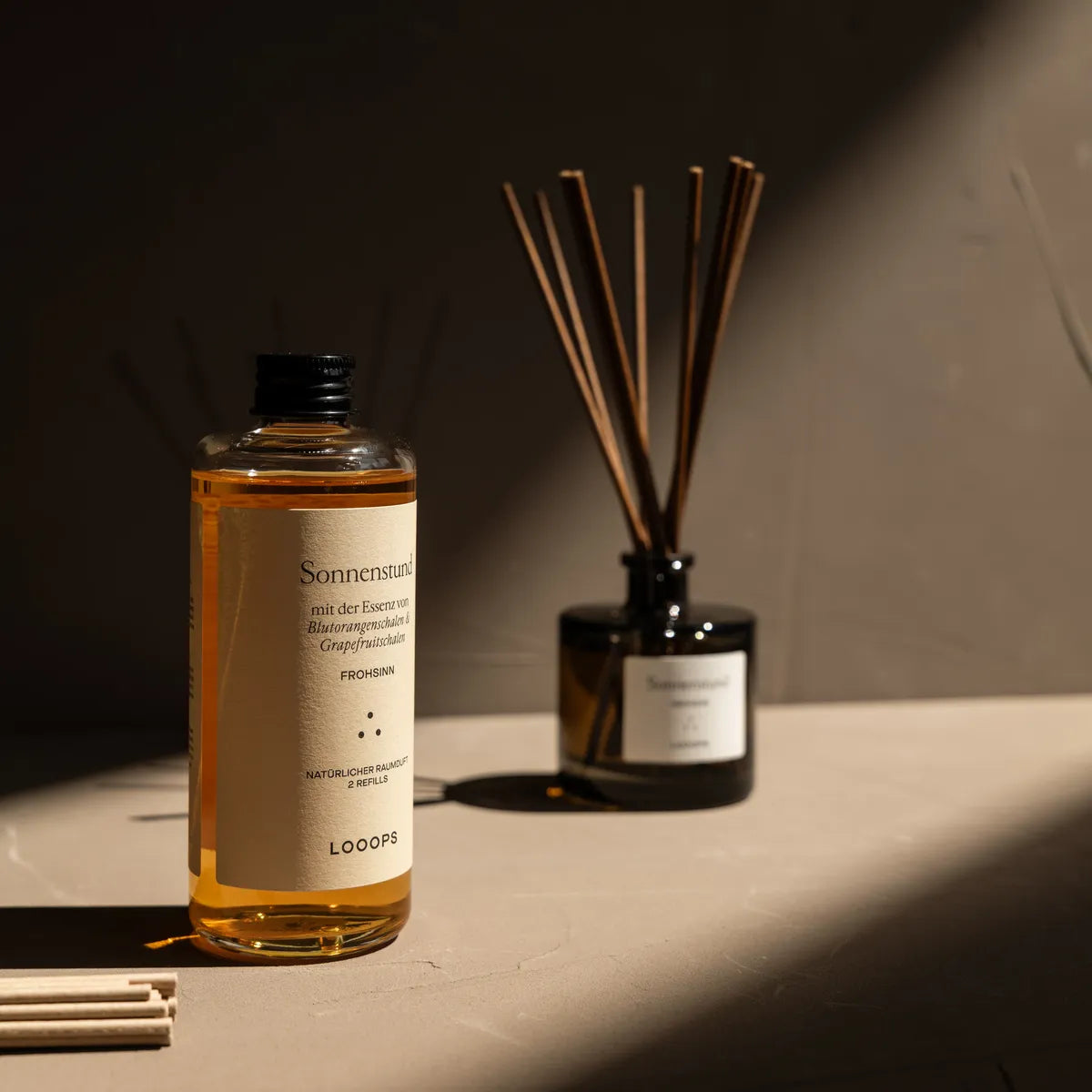 Glass bottle in front of stick diffuser