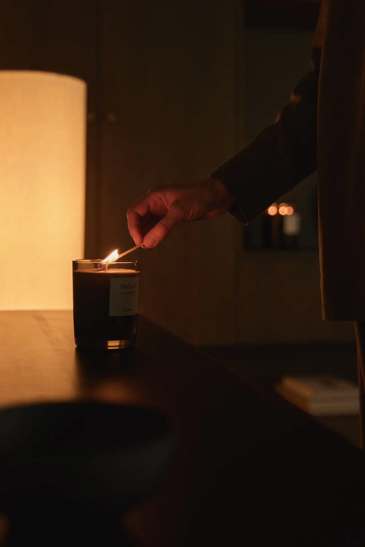 Large scented candle, " Abendgold " by Looops, lit in the evening
