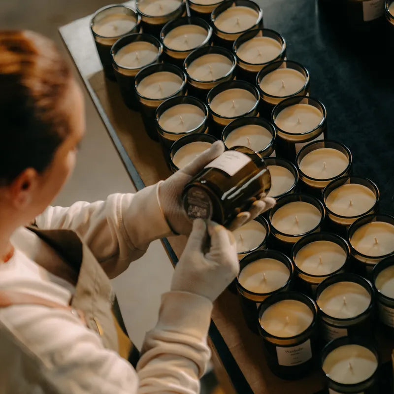 Table full of candles during labeling.