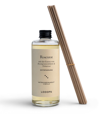 Glass bottle of Rosenrot room fragrance with paper sticks