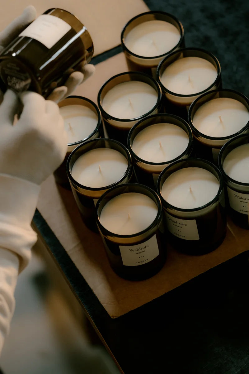 Scented candles are covered with labels.