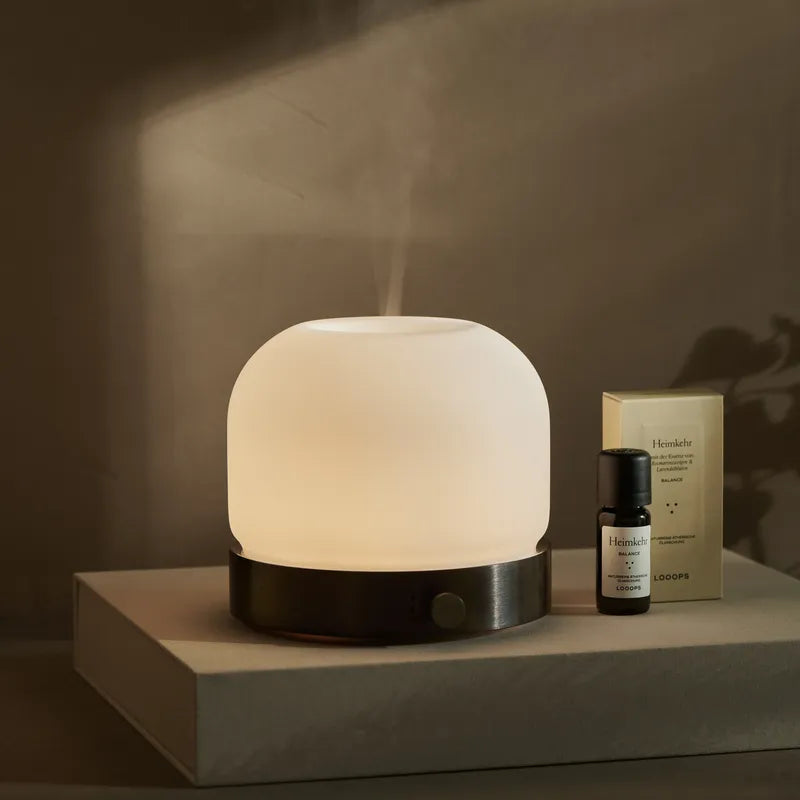Aroma diffuser with essential oil
