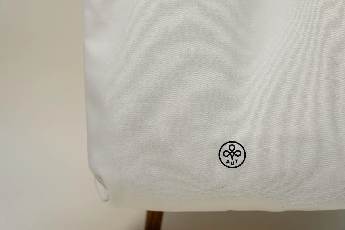 White bag with small black print