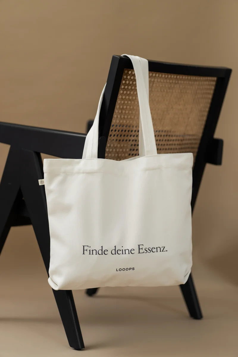 White bag hanging on chair