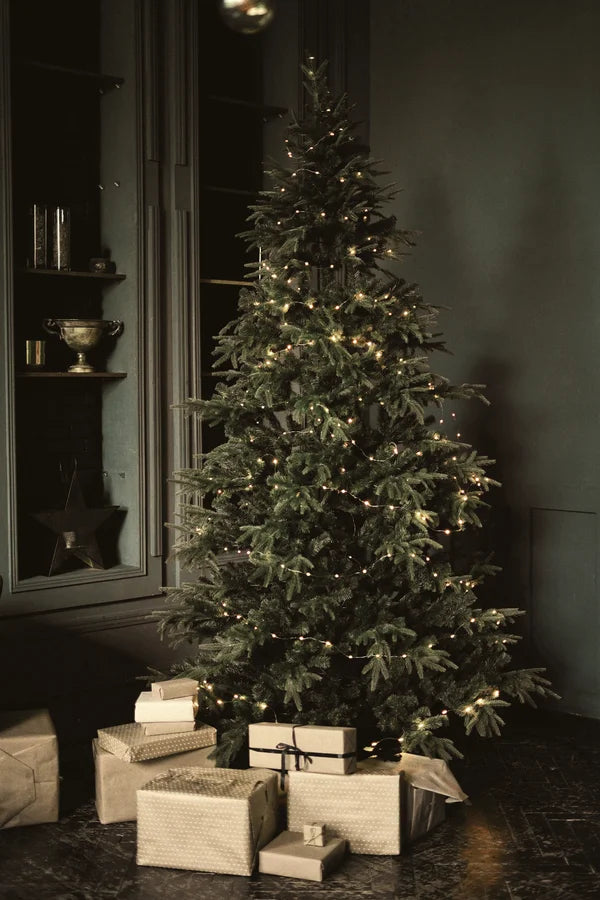 Illuminated Christmas tree with presents